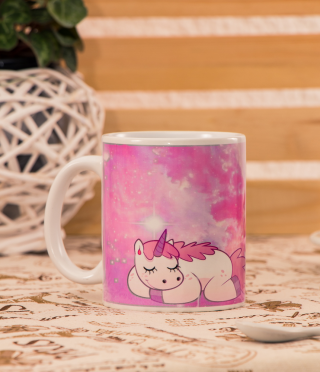 A cup with a sleeping unicorn