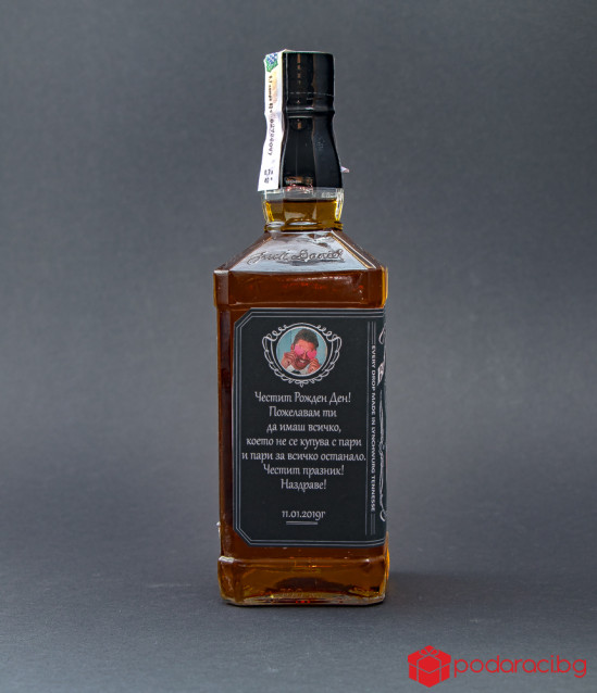 Bottle of Jack Daniels with customized label and engraved Cup