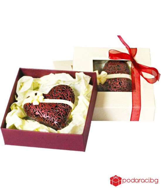 A box with a lace chocolate heart