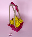 Basket with yellow everlasting roses