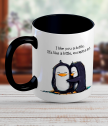 Ceramic mug with a pair of penguin
