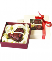 A box with a lace chocolate heart